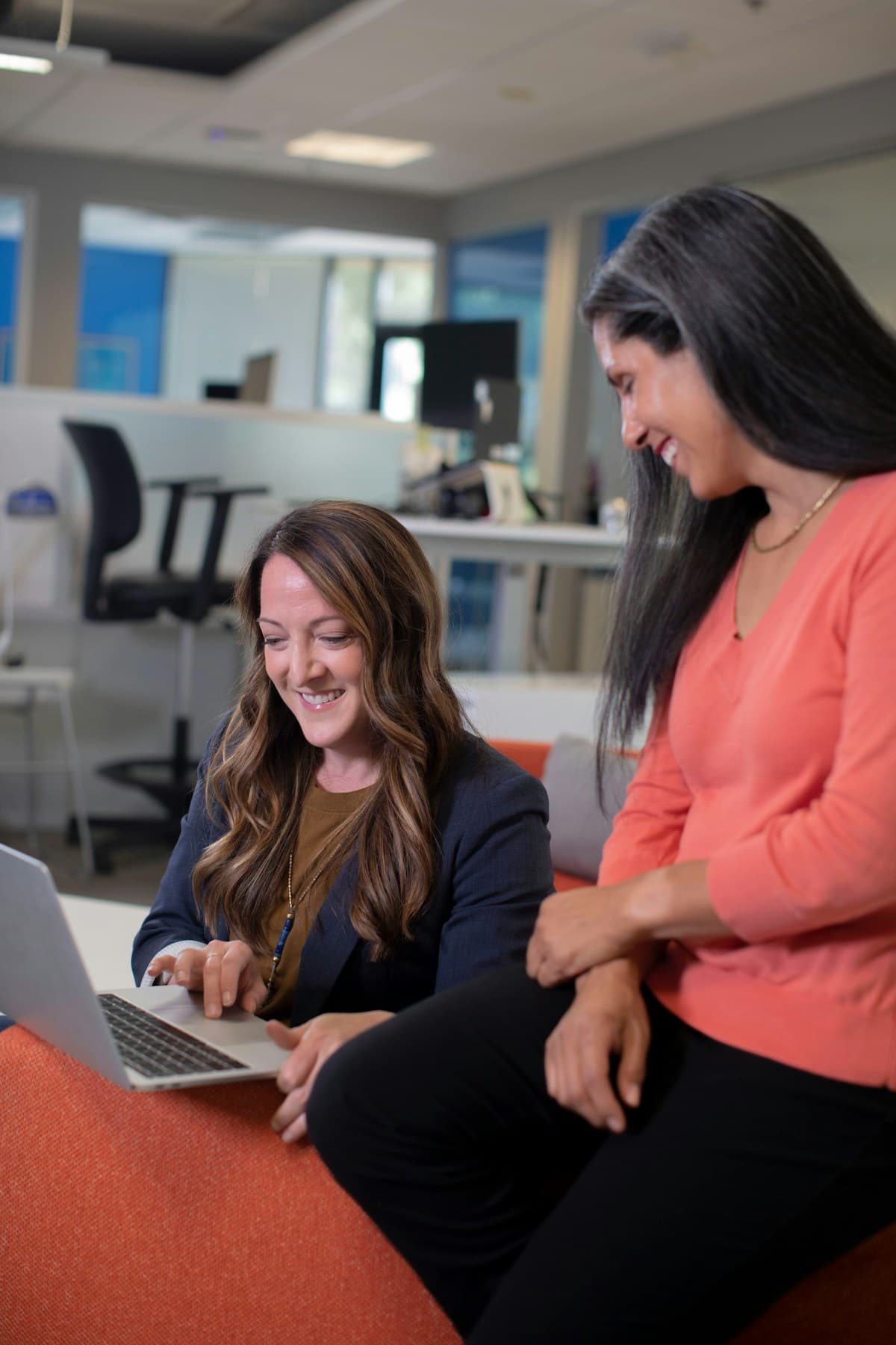 Two colleagues collaborating in a bright professional office